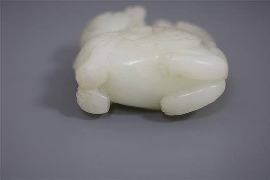 A Chinese white jade figure of bixi with a bird on its back, 17th/18th century, L. 5.4cm, wood stand